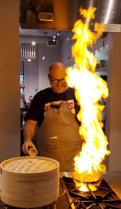 Christopher Mulvaney cooking with open flames